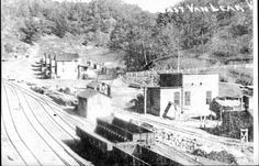 an old black and white photo of train tracks
