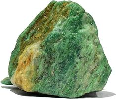 a green and yellow rock sitting on top of a white surface
