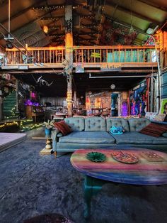 a living room filled with furniture and lots of lights on top of it's ceiling