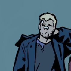 a man in a blue jacket is holding his hand up to his ear and looking at the camera