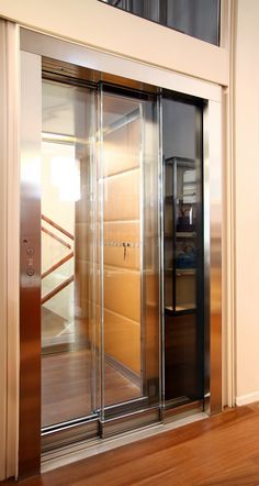 an open glass door leading to another room