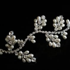 an image of a tiara with pearls on it