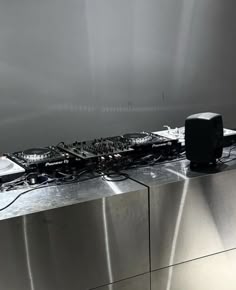 there is a dj mixer on top of the counter