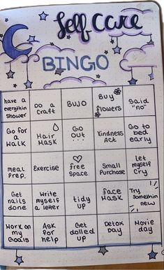 a handwritten self care bingo board with stars and moon on the top, surrounded by words written in cursive writing