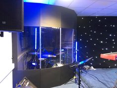 a recording studio with sound equipment and lights