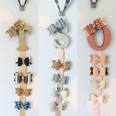 three different types of bows are hanging on the wall