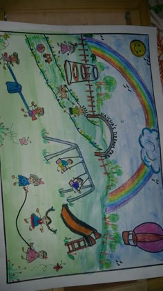 a child's drawing of an amusement park with rainbows and roller coasters