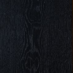 black wood textured with dark stain on it