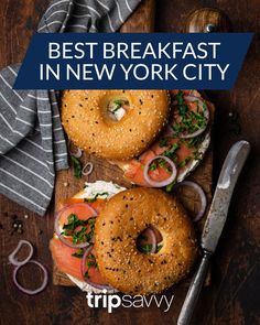 two bagels on a cutting board with the words best breakfast in new york city