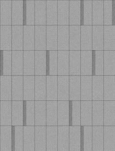 a gray tiled wall with vertical lines on the bottom and diagonals at the top