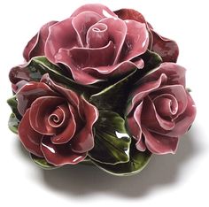 three pink roses sitting on top of each other