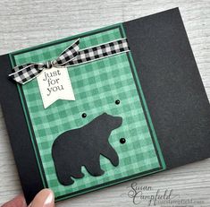 someone holding up a card with a bear on it and the words just for you