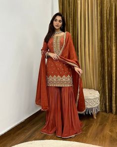 Orange Rust Colour Suit, Burnt Orange Pakistani Suit, Rust Orange Sharara, Orange Garara, Orange Desi Outfit, Rust Orange Dress Outfit, Rust Colour Suit, Plazzo Suit, Rust Orange Suit