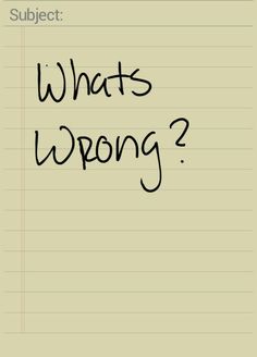 a note with the words what's wrong? written in black ink on it