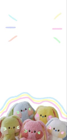 a group of small stuffed animals sitting next to each other