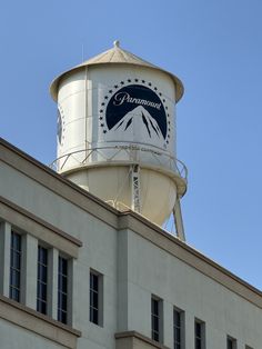 a water tower on top of a building with the words fremont painted on it's side