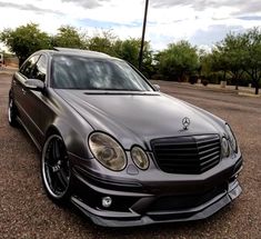 a mercedes benz is parked in the parking lot