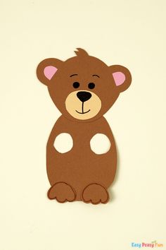 a paper cut out of a brown bear