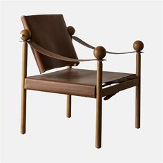 a brown chair with two wooden legs and a leather seat on the back is shown