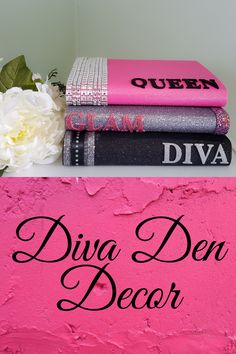 three books sitting on top of each other next to a pink wall and white flowers