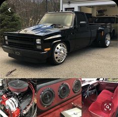 the truck is parked in front of the garage and has speakers on it's hood