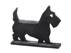 a small black dog figurine on a white background