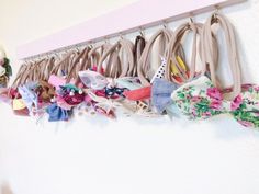 a bunch of hair clips hanging on a wall