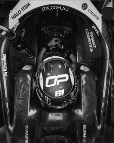 the front end of a racing car with its hood up