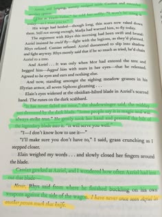 an open book with green and yellow lines on it