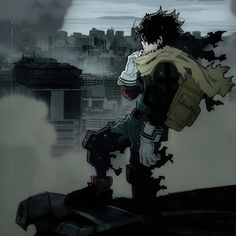 a man standing on top of a roof next to a tall building in the rain