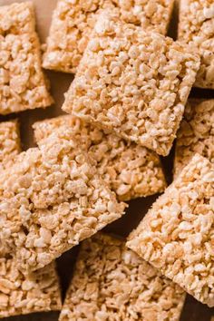 homemade rice krispy treats stacked on top of each other in a square tray with text overlay