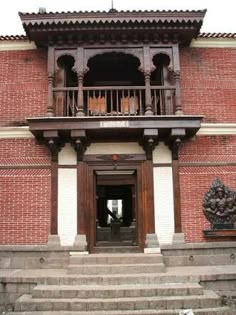 an entrance to a building with steps leading up to it