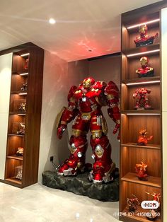 a large iron man statue sitting in the middle of a room