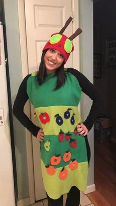 a woman wearing a costume made to look like a ladybug and apple slice