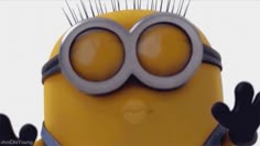 a close up of a minion with spikes on it's head