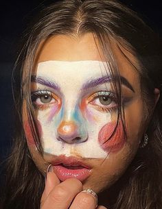 Creative clown makeup, artistic Halloween makeup, watercolor-inspired makeup, colorful face paint ideas, bold eye makeup, avant-garde beauty look, dramatic blush makeup, exaggerated eyebrow look, unique clown aesthetic, artistic editorial makeup, abstract face paint, vibrant eyeshadow look, whimsical makeup idea, surreal beauty inspiration, trendy TikTok makeup, expressive makeup art, fantasy-inspired face paint, colorful stage makeup, DIY creative makeup, glossy lip makeup, bold highlighter makeup, dreamy artistic makeup, makeup for photoshoots, unconventional beauty look, fun and playful makeup, aesthetic makeup inspiration. Creative Eyebrow Makeup, Artistic Clown Makeup, Fun Clown Makeup, Abstract Makeup Ideas, Makeup Looks Abstract, Crazy Makeup Looks Creative Full Face, Clown Face Paint Inspo, Colorful Clown Makeup, Dreamcore Makeup