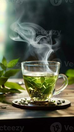 AI Generative Green tea in a glass cup with a steam with dry tea leaves on a wooden background