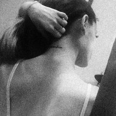 a woman is getting her hair done in the mirror