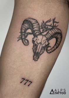 a ram skull with horns on the thigh and number 17 tattoo design by alex attattoo