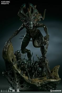 the alien hunter statue is on display