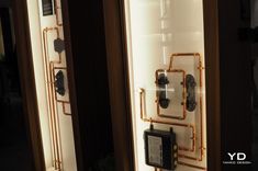 an old fashioned phone is on display in a store window with gold trimmings