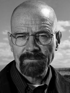 an old black and white photo of a man with glasses