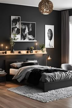a bedroom with black walls and wooden flooring is pictured in this image, there are candles lit on the bed