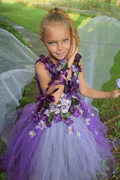 Fairy couture Tutu dress and arm cuff (1 arm cuff)sold separate. Perfect for fairy festivals, fairy birthdays, fairy costume for any occasion. purple fuzzy top with embroidery flowers 3D satin flowers with iridescent rhinestones  black lavender and purple tulle is used on the skirt. Purple Whimsical Tutu Dress For Costume Party, Purple Fairy Dress For Dress-up Occasions, Child's Fairy Costume Dress, Purple Fairy Costume With Flowers, Purple Tulle Fairy Dress For Dress-up, Purple Fairy Costume Kids, Fairy Dress Costume, Purple Fairy Dress For Kids, Whimsical Purple Tutu Dress For Dress-up
