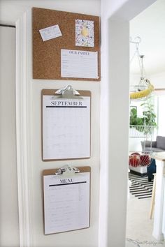 a cork board with calendars attached to it