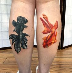 two goldfish tattoos on both legs, one is black and the other is red