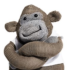 a sock monkey wrapped in a white t - shirt with his hands on his hips