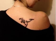 a woman with a bird tattoo on her back shoulder