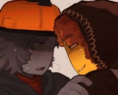 two people wearing orange hats and one is looking at his cell phone