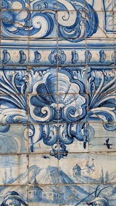 blue and white tiles with designs on them